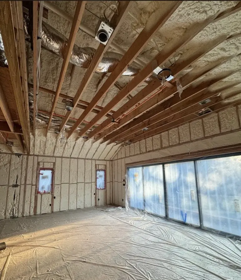 Interior walls and ceiling insulated with spray foam during new construction in Middle